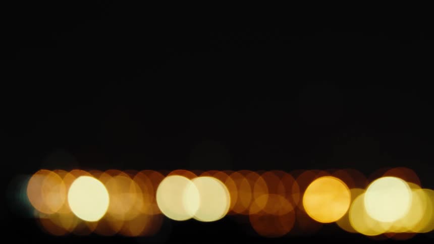 Lights flicker on a dark night