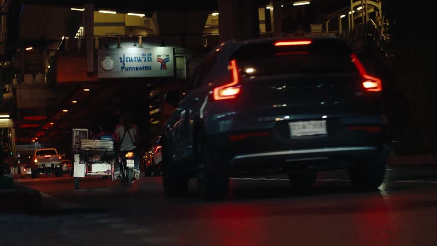 Traffic flows under the overpass at night