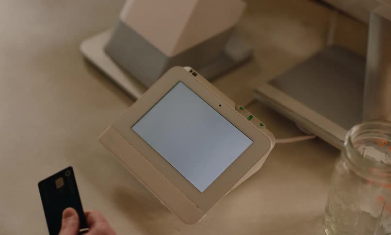 A customer taps their card to make a payment