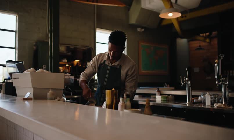 Man preparing coffee in a coffee shop