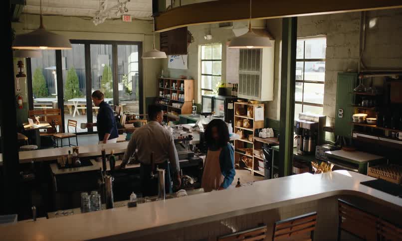A worker is cleaning in the restaurant kitchen