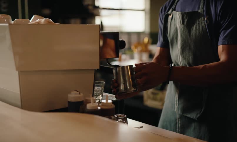 Two employees are working behind the counter