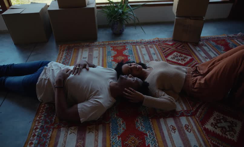 A footage of a couple laying down and having a romantic moment