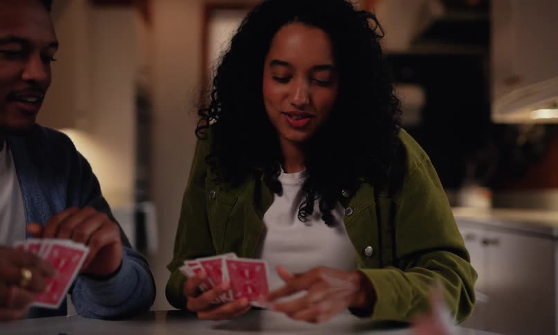 Friends play cards together