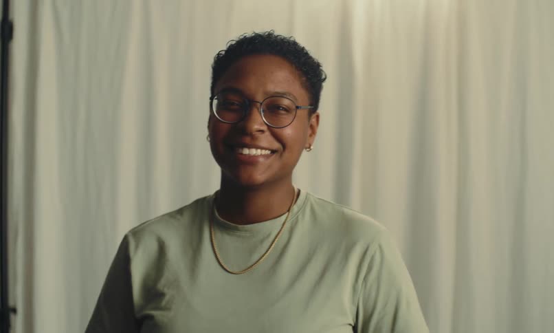 A woman moves and smiles