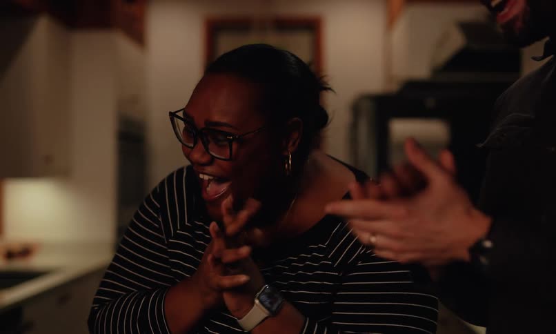 Woman and a man clapping warmly