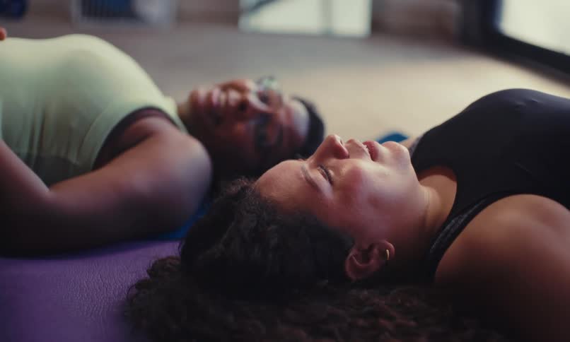 A couple people rest after exercising