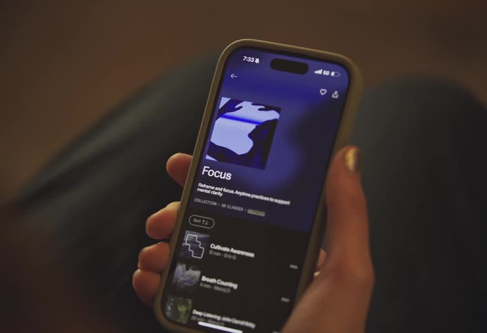 Pair of hands interacting with a smartphone