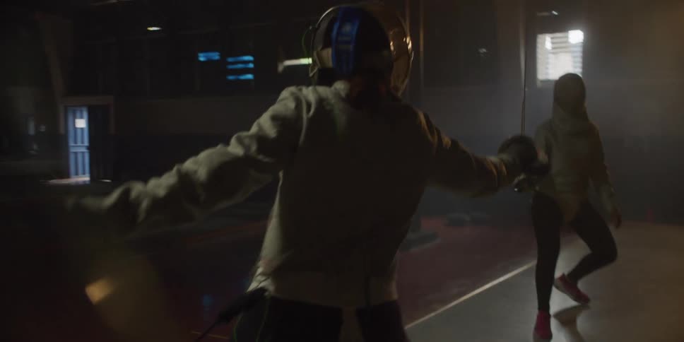 Two women fencing
