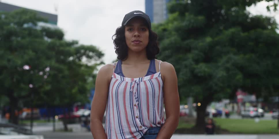 Woman wearing a cap outdoors in the city