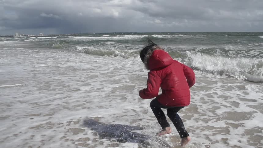 A kid jumping in the water