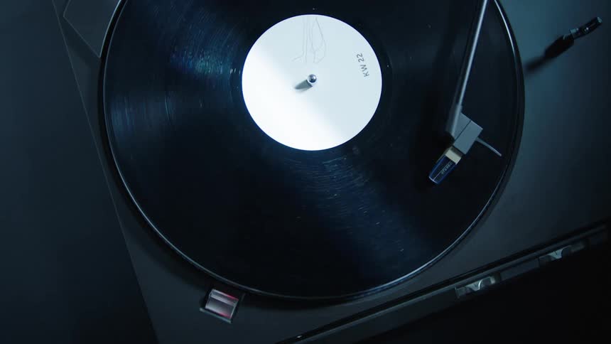A vinyl record spinning on a turntable