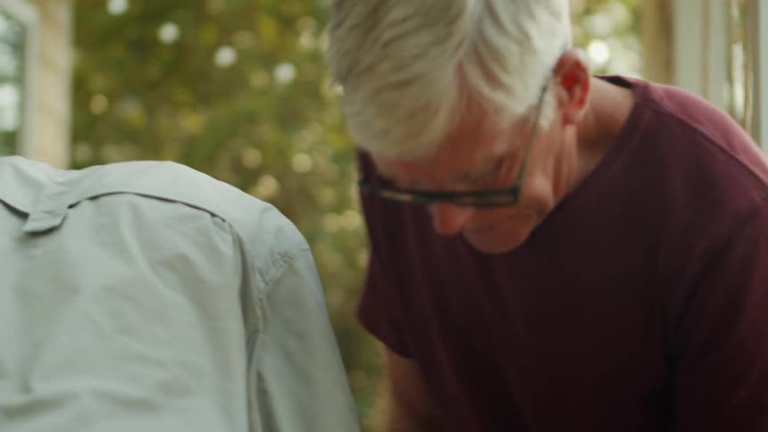 Man with a screwdriver drilling a wood