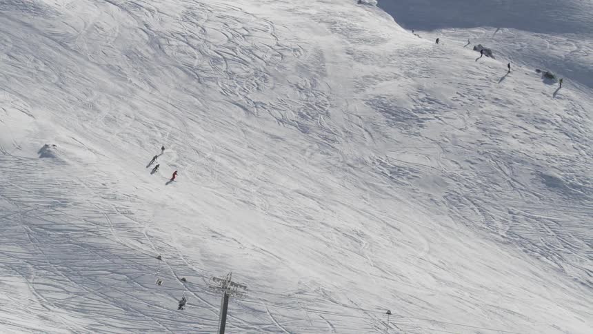People skiing down a mountain