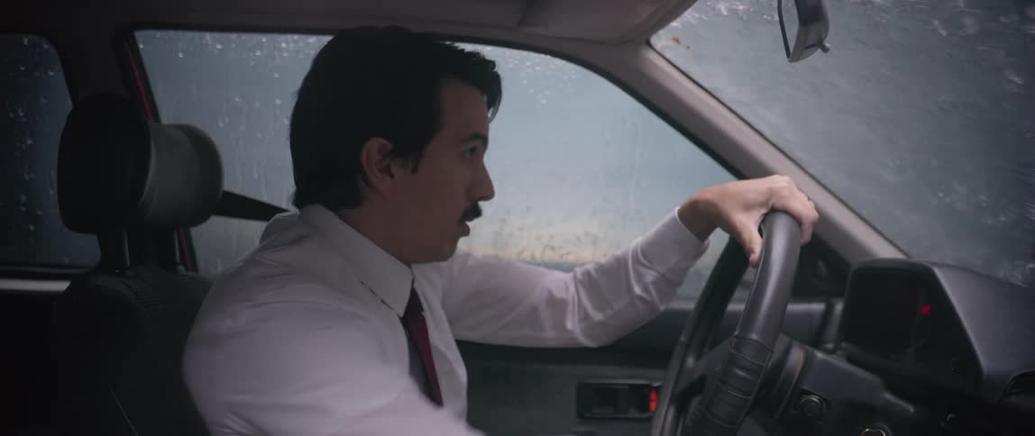 A man is scared as he drives during heavy rainfall