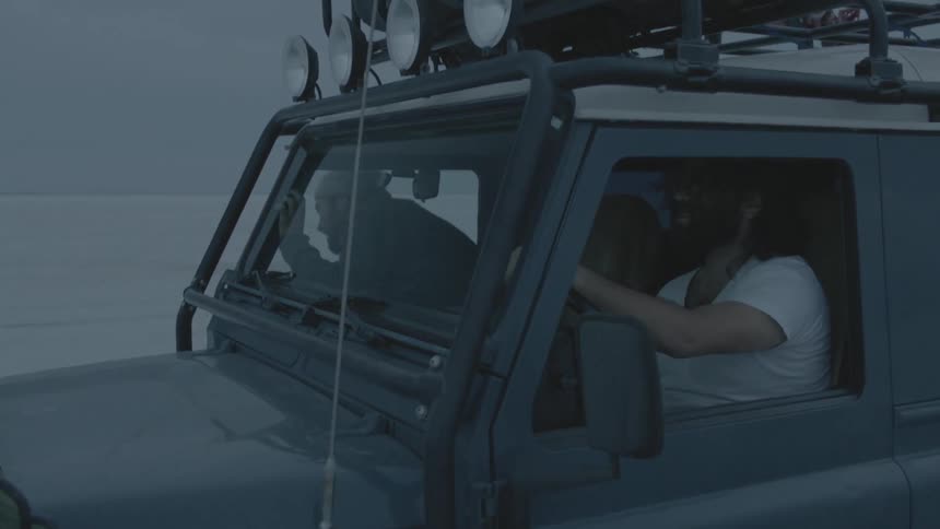 Two people in a jeep