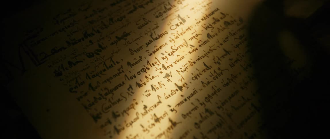 A large book with foreign handwritten text sits on a surface
