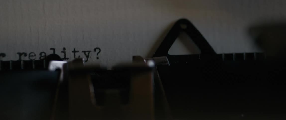 A typewriter is typing out words on the paper