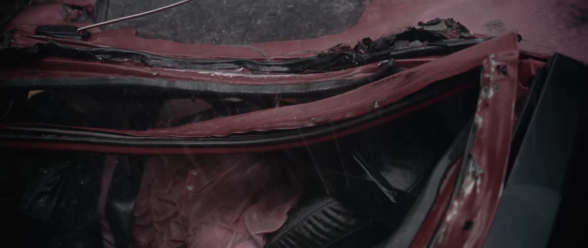Inspecting a crushed car