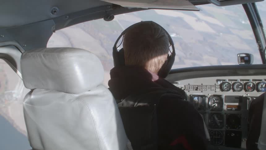 Pilot at the cockpit flying plane