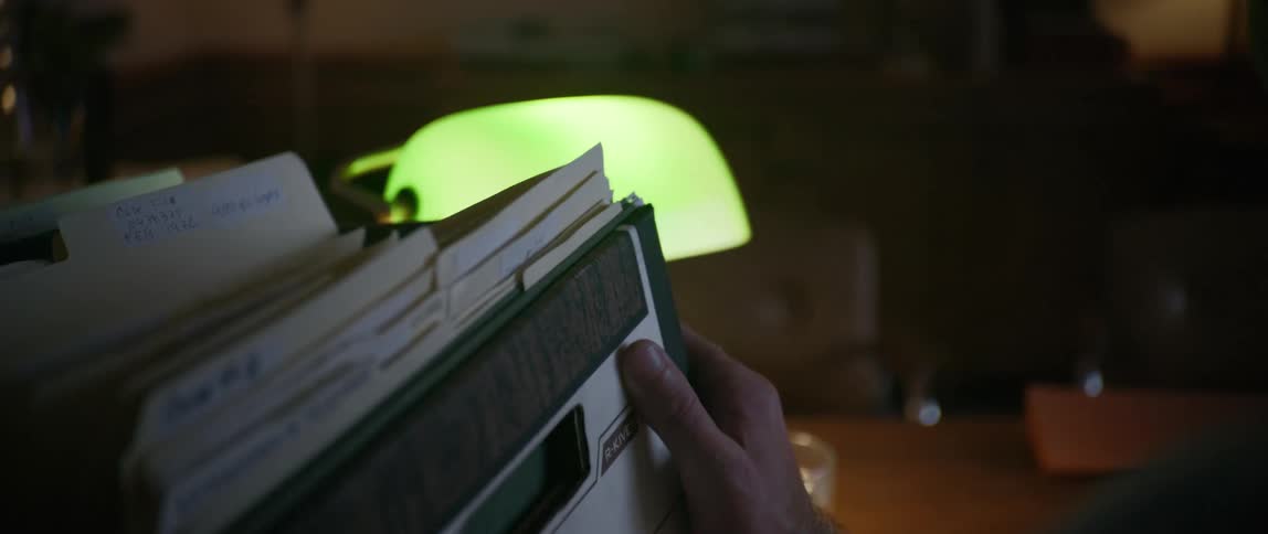 A footage of a person lifting an archive of documents