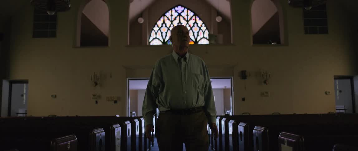A man walks through a church