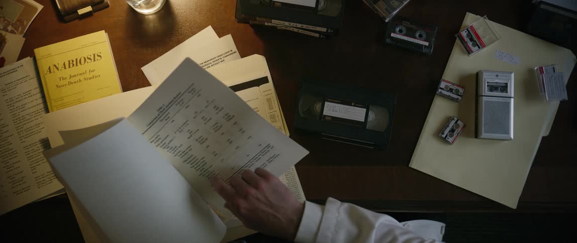 Pair of hands leafing through a document