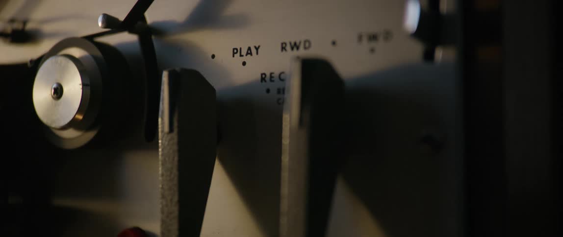 A man turning off the vcr recorder