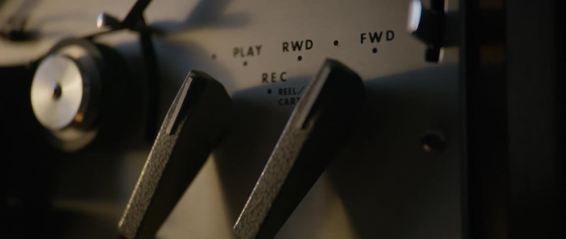 Person sets the tape player to play forward