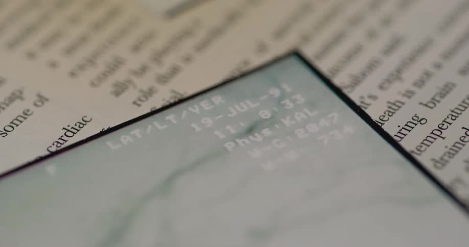 A stack of papers comes into focus