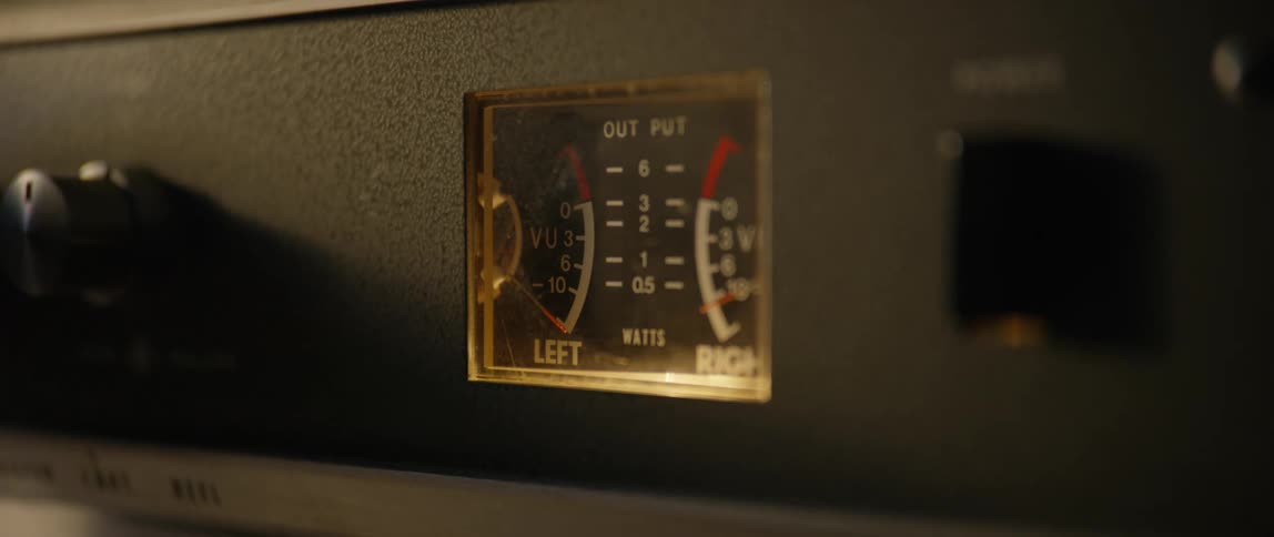 Person turns a dial before turning off a piece of electrical equipment