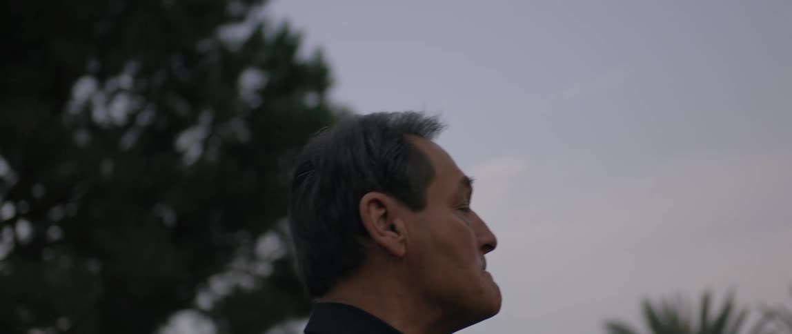 A man walks away from the house