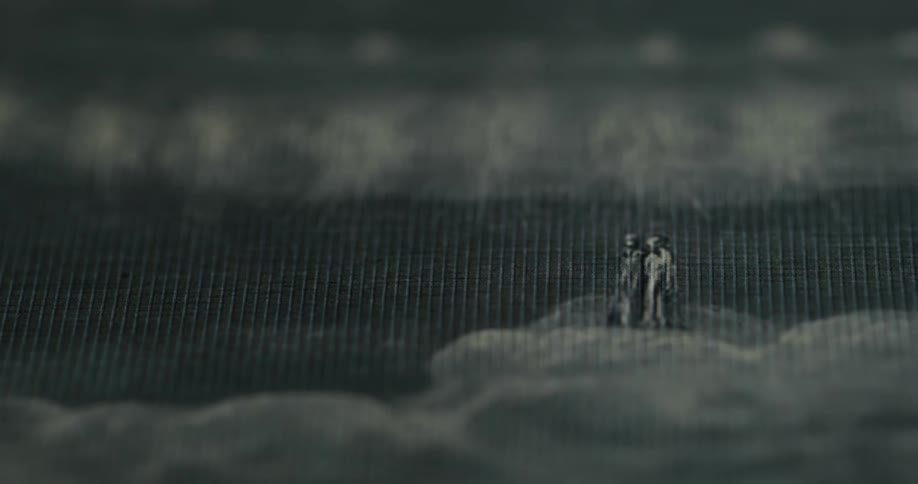 Closeup of abstract black and white fabric with human figures