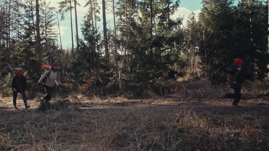 Family running through a forest