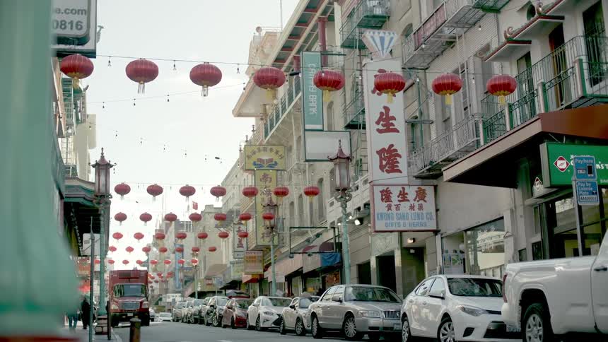 Chinese lanterns strung across store front buildings in china town