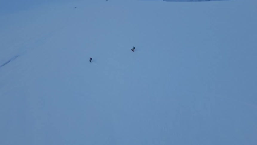 Two people skiing on a snowy mountain in switzerland