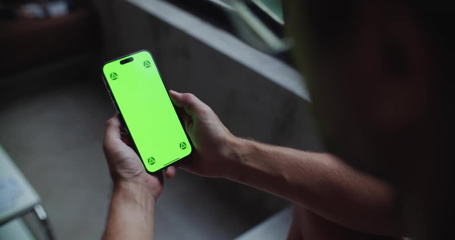 A man is viewing his cell phone
