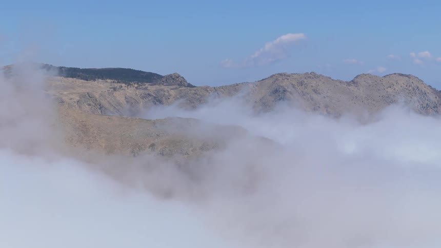 Mountains and clouds under a blue sky