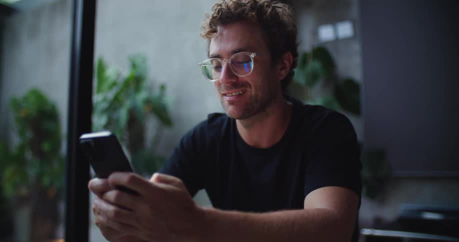 A footage of a man operating a phone