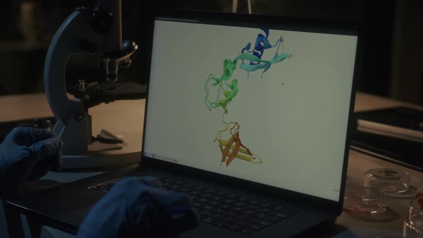 A computer screen has a diagram of a dna strand