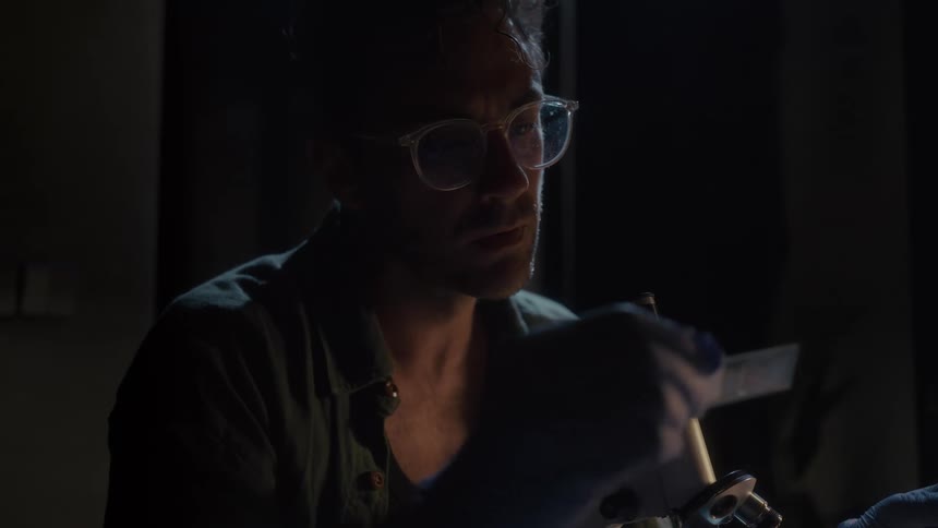 The scientist is working late at night