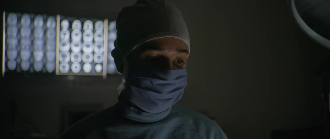 A footage of a surgeon putting in a blue mask