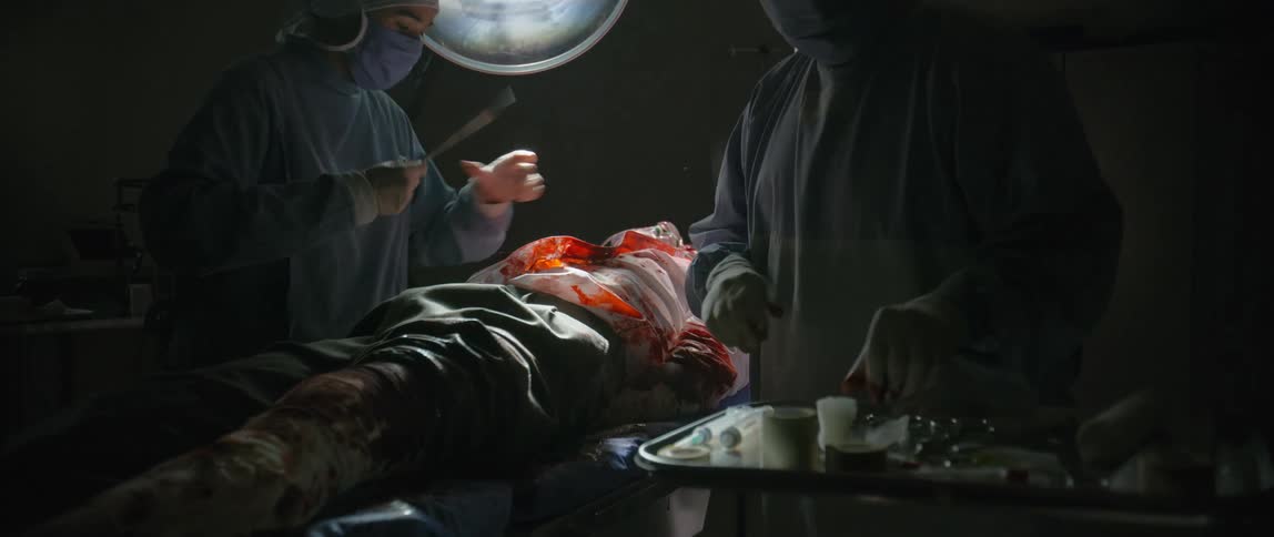 A man is receiving emergency surgery