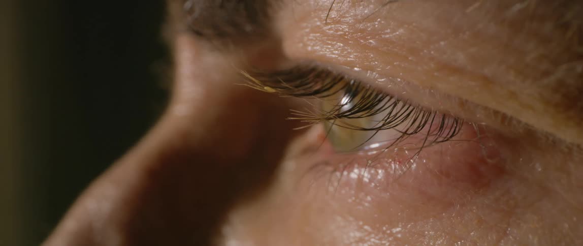A person blinks as they look from side to side