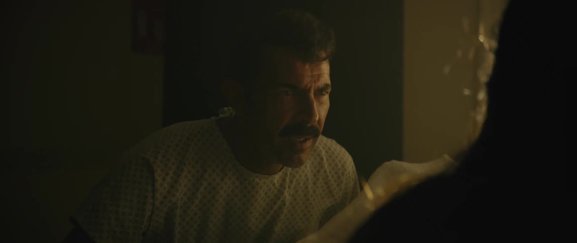 Patient man in a room talking with aggressive expression
