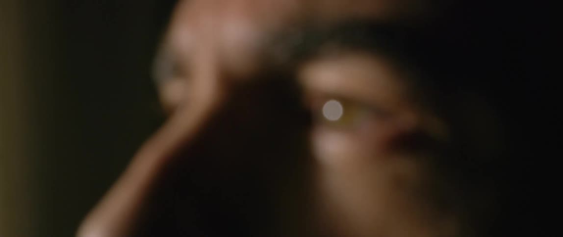 A man is staring out the window