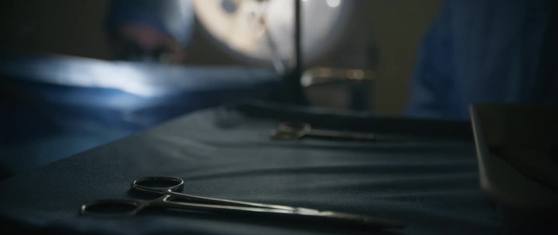 Doctors performing surgery in an operating room