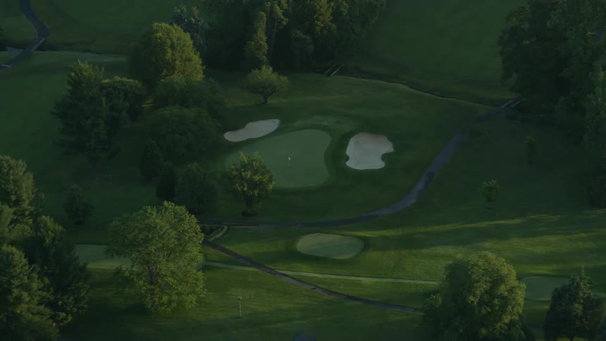 The green golf course below is empty