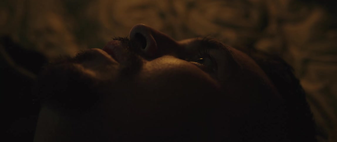A scared man is laying down