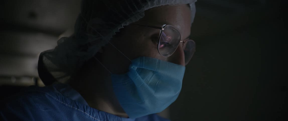 A doctor is talking in the dark hospital